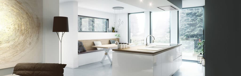 Cocina blanca luminosa con isla junto a grandes ventanales