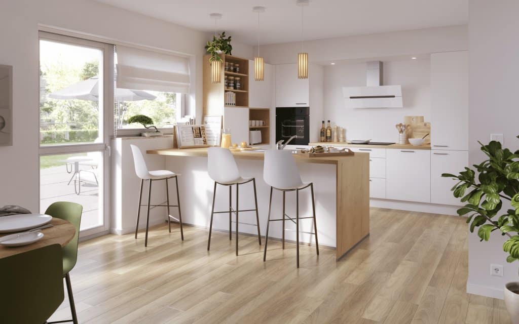 Cocina en U con isla y taburetes altos junto a grandes ventanales